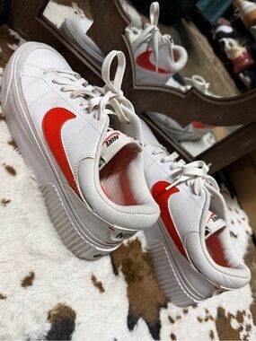 Nike White Low-Top Sneakers with Red Swoosh